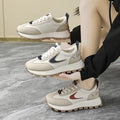  Women Breathable Casual Sneakers worn with a black hoodie, showcasing light comfort shoes in a stylish setting.