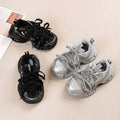 Girls Casual Sneakers in silver with lace-up design and soft comfortable bowtie style.