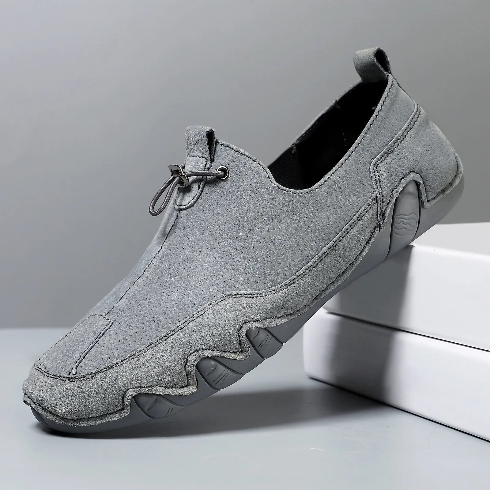 Men’s Casual Leather Sneakers – Comfortable Walking Shoes in a hand-held view showcasing black leather design