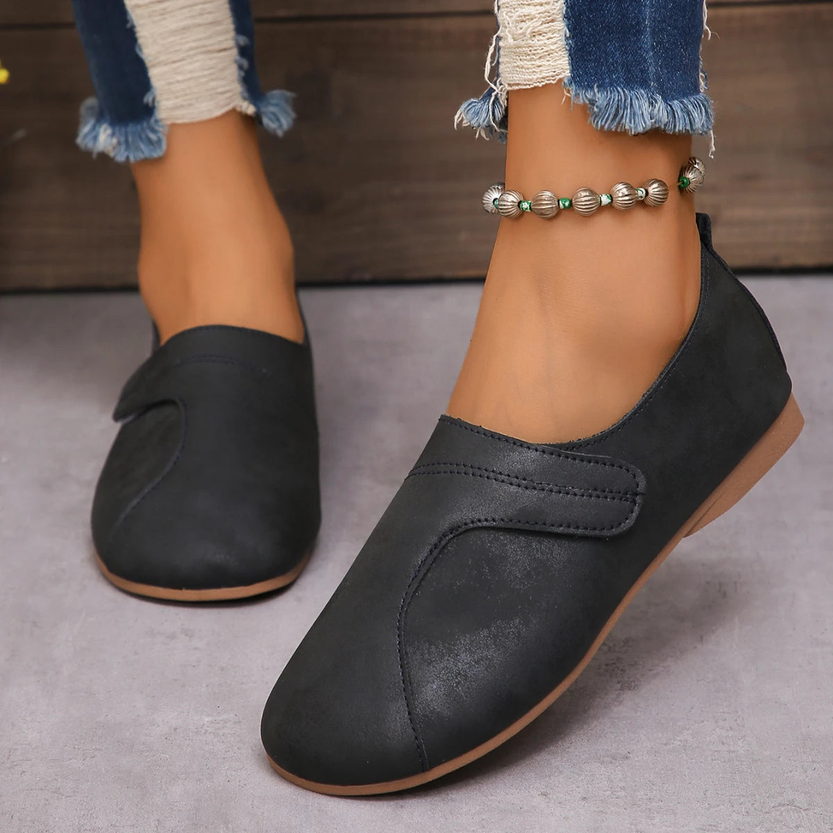 Women Retro Leather Sneakers in blue, stylish slip-on casual shoes with comfortable design and textured finish.