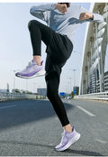  Lightweight Running Sneakers being worn by a person on a bridge, showcasing breathable and non-slip features.