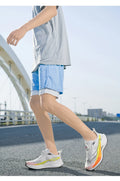  Lightweight Running Sneakers being worn by a person on a bridge, showcasing breathable and non-slip features.