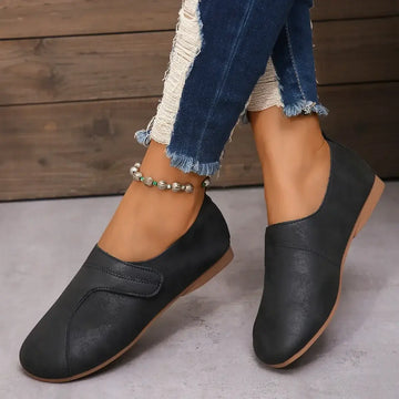 Women Retro Leather Sneakers in blue, stylish slip-on casual shoes with comfortable design and textured finish.