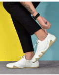 Men’s Casual Leather Sneakers – Comfortable Walking Shoes in a hand-held view showcasing black leather design