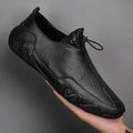 Men’s Casual Leather Sneakers – Comfortable Walking Shoes in a hand-held view showcasing black leather design