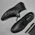 Men’s Casual Leather Sneakers – Comfortable Walking Shoes in a hand-held view showcasing black leather design