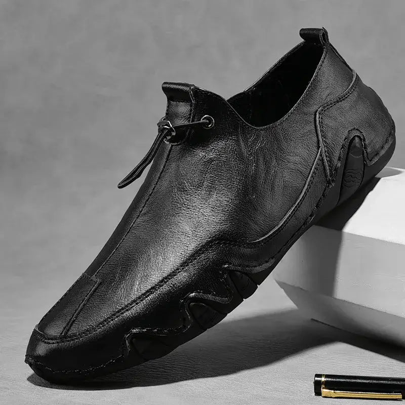 Men’s Casual Leather Sneakers – Comfortable Walking Shoes in a hand-held view showcasing black leather design
