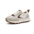  Women Breathable Casual Sneakers worn with a black hoodie, showcasing light comfort shoes in a stylish setting.