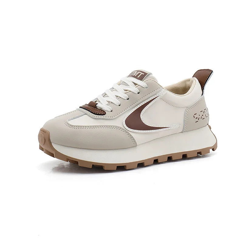  Women Breathable Casual Sneakers worn with a black hoodie, showcasing light comfort shoes in a stylish setting.