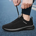 Men's Lightweight Running Sneakers in black being laced up, perfect for casual and sporty looks.