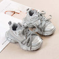Girls Casual Sneakers in silver with lace-up design and soft comfortable bowtie style.