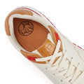 Women Orthopedic Sneakers – Comfortable Balance Shoes displayed on mossy ground with outdoor tools and rustic background.