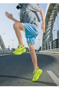  Lightweight Running Sneakers being worn by a person on a bridge, showcasing breathable and non-slip features.