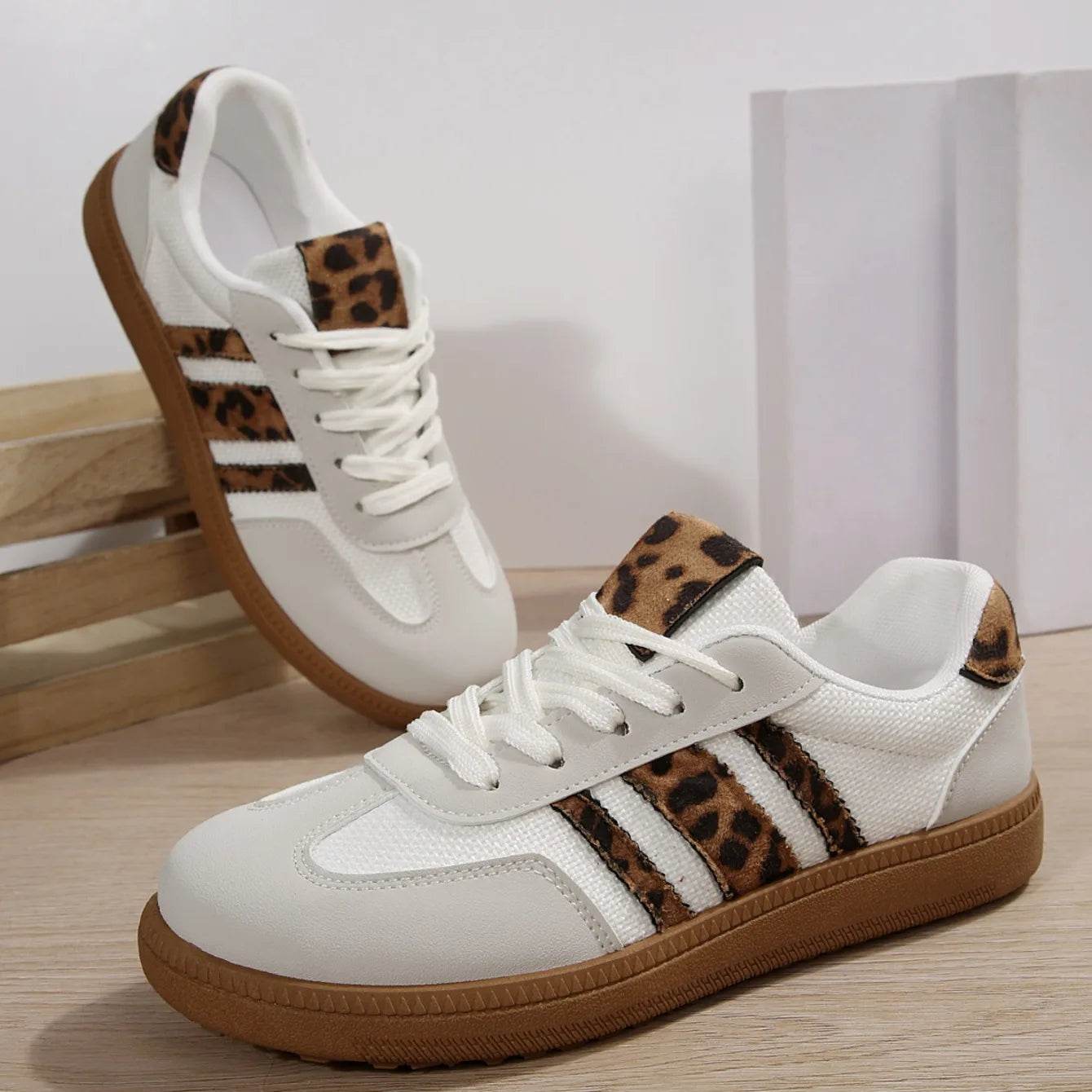  Women Luxury Designer Sneakers 2025 with leopard print accents and slip-on style for casual comfort.