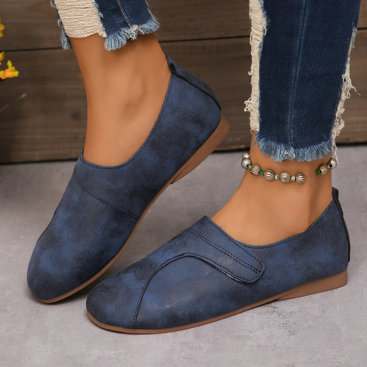 Women Retro Leather Sneakers in blue, stylish slip-on casual shoes with comfortable design and textured finish.