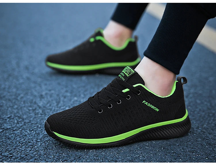 Men's Lightweight Running Sneakers in black being laced up, perfect for casual and sporty looks.