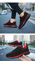 Men's Lightweight Running Sneakers in black being laced up, perfect for casual and sporty looks.