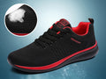 Men's Lightweight Running Sneakers in black being laced up, perfect for casual and sporty looks.