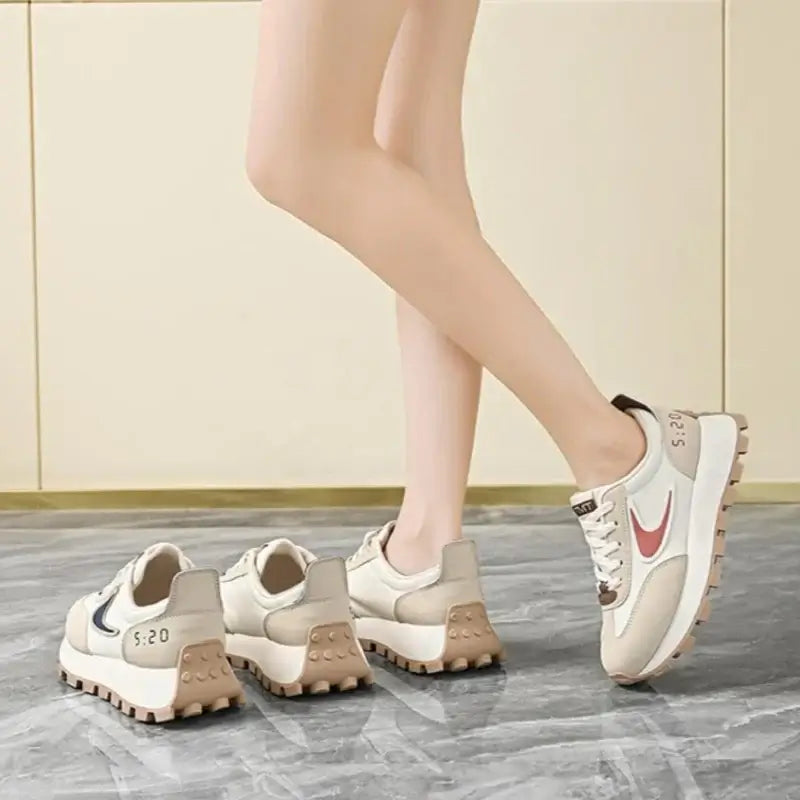  Women Breathable Casual Sneakers worn with a black hoodie, showcasing light comfort shoes in a stylish setting.
